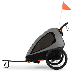 Remolque de bicicleta y coche de paseo Nava Walk 2 en 1 Kinderkraft en gris, vista lateral en modo remolque con manillar plegado