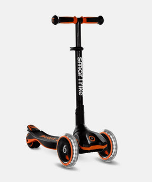 scooter para niño pequeño color negro y naranjo marca smartrike