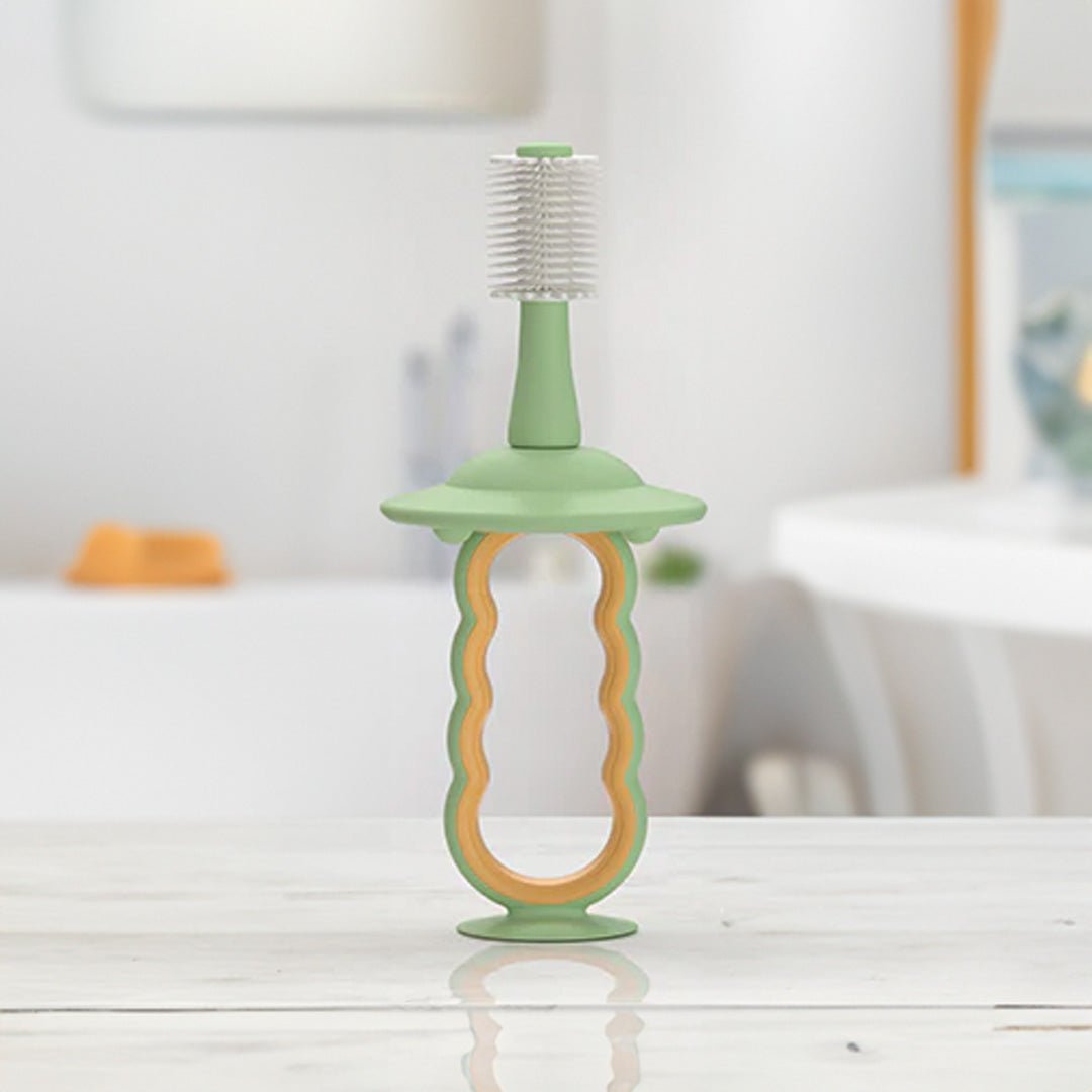 Cepillo dental de silicona para bebé color Verde - vista en uso
