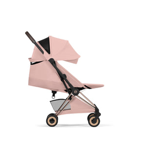Coche de paseo Cybex Coya Style Collection Peach Pink con respaldo reclinado en posición horizontal