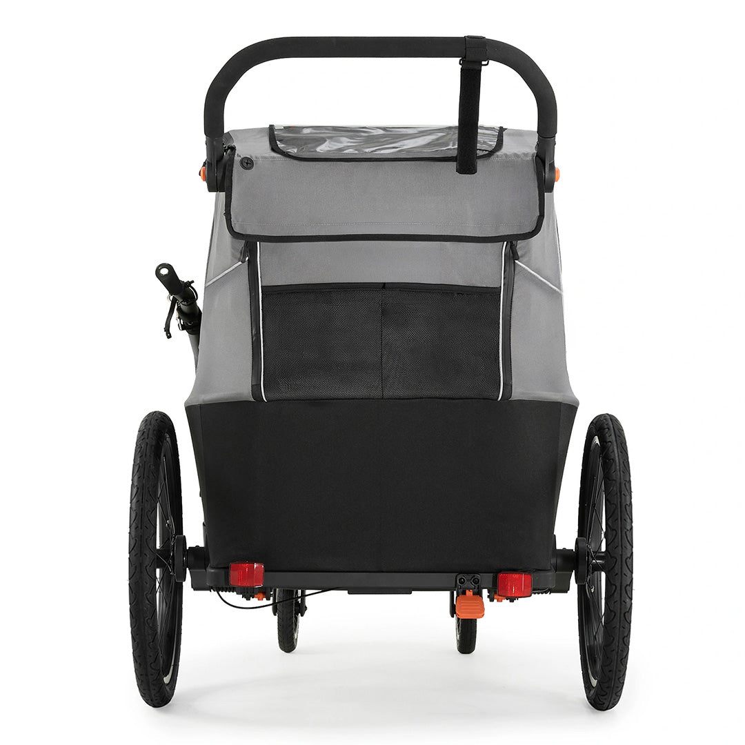 Remolque de bicicleta y coche de paseo Nava Walk 2 en 1 Kinderkraft en gris, vista trasera mostrando el bolsillo de almacenamiento y ambas ruedas